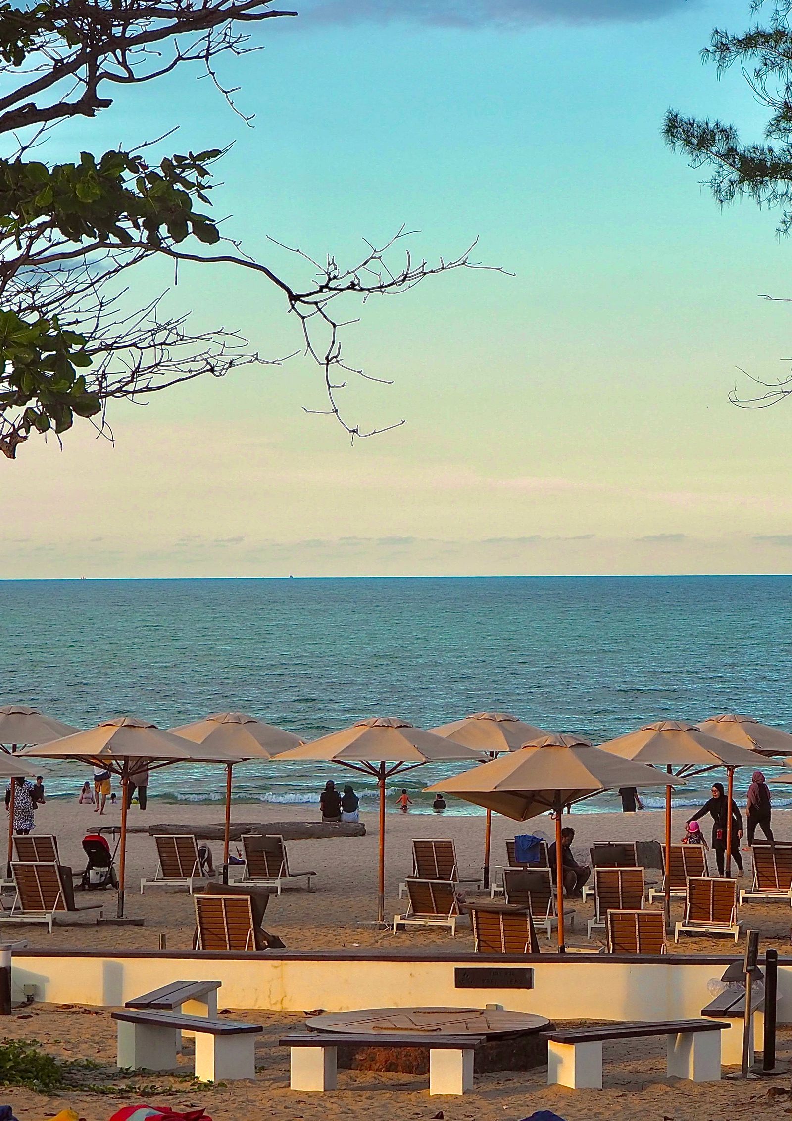Colourful beach umbrellas along a seaside town