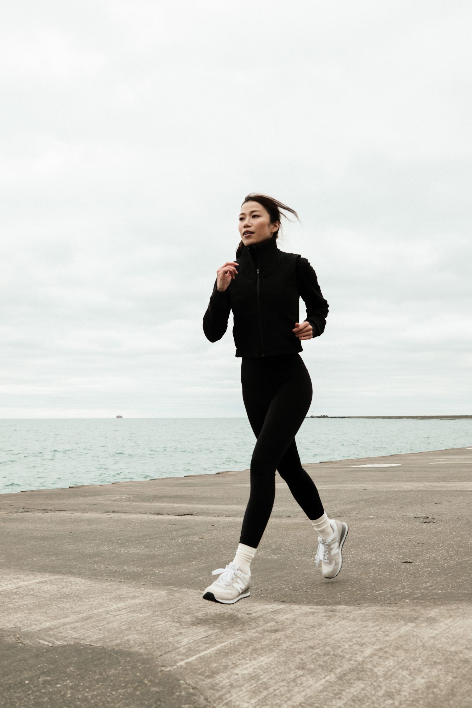 Person jogging along a waterfront path, similar to the Bay Run near Leichhardt