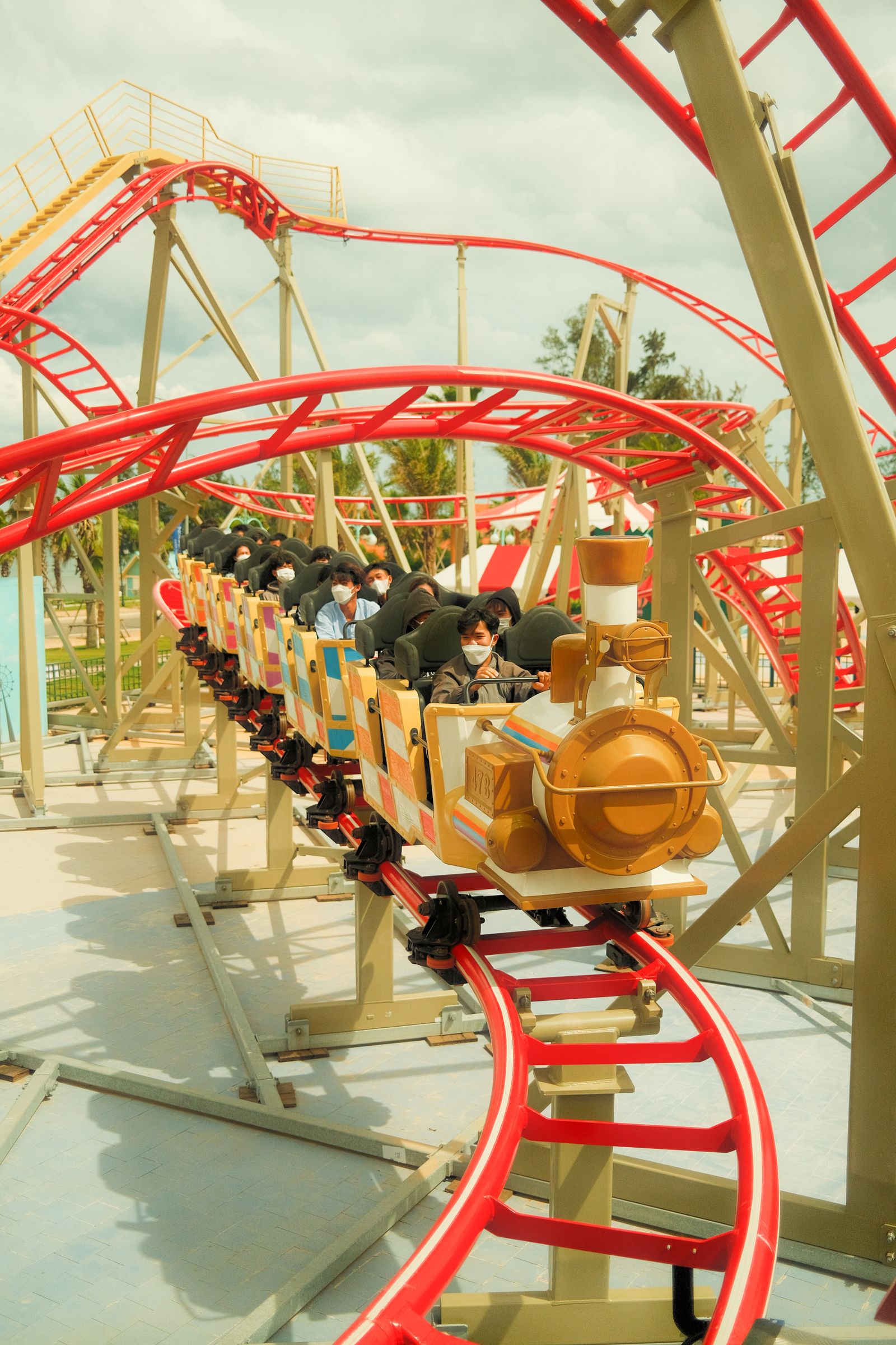 People enjoying a thrilling roller coaster ride at a theme park