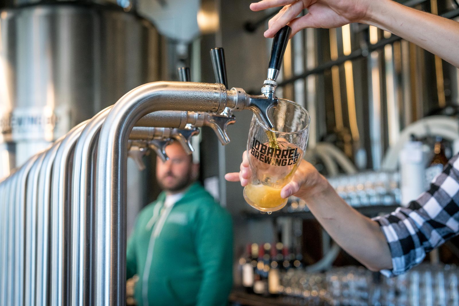 Craft beer being poured at a brewery taproom