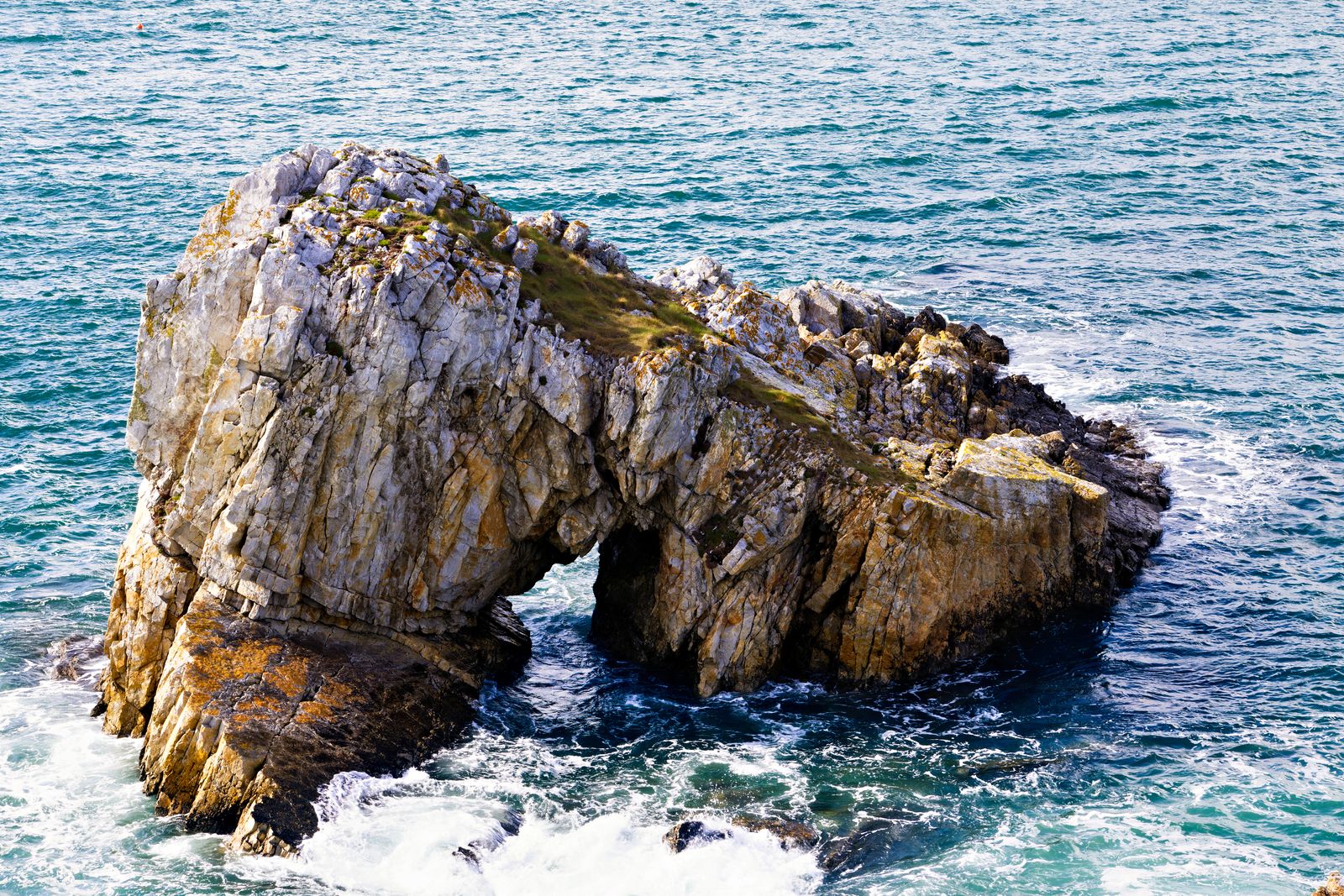 Dramatic coastal rock formation with ocean waves