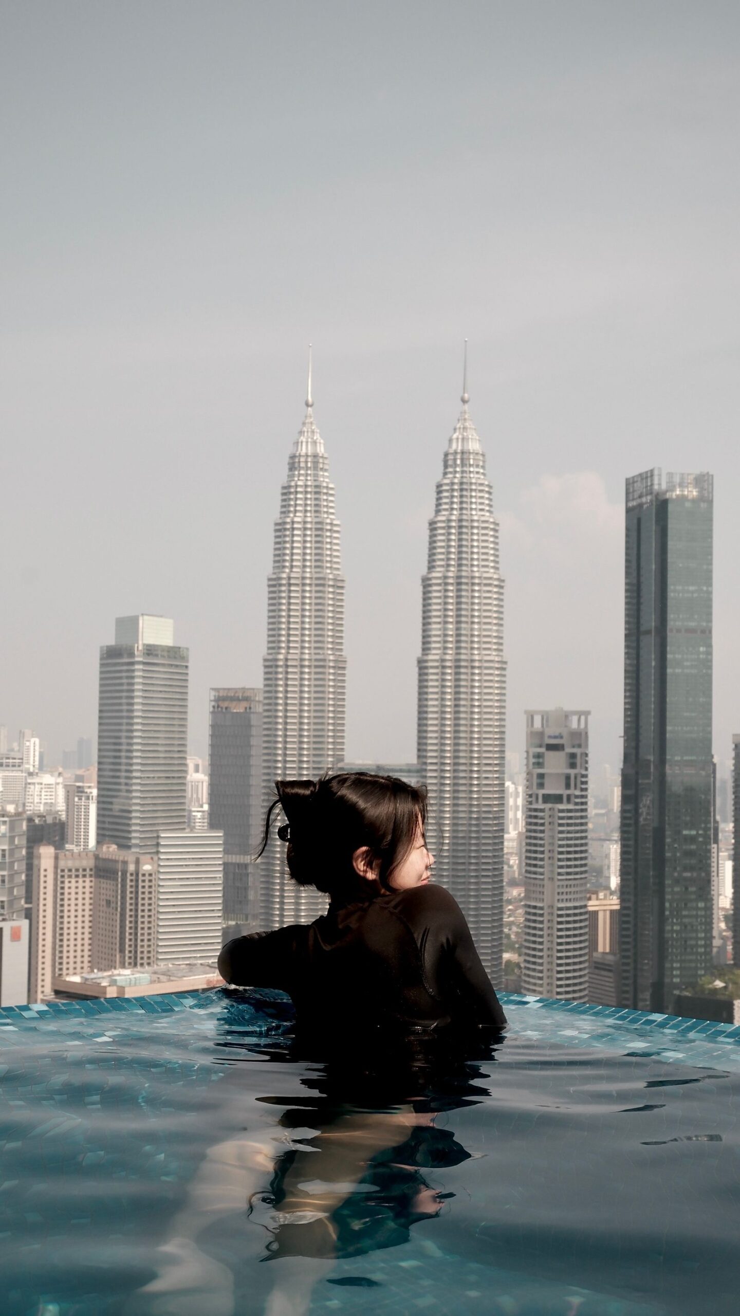 Rooftop infinity pool with a city skyline view