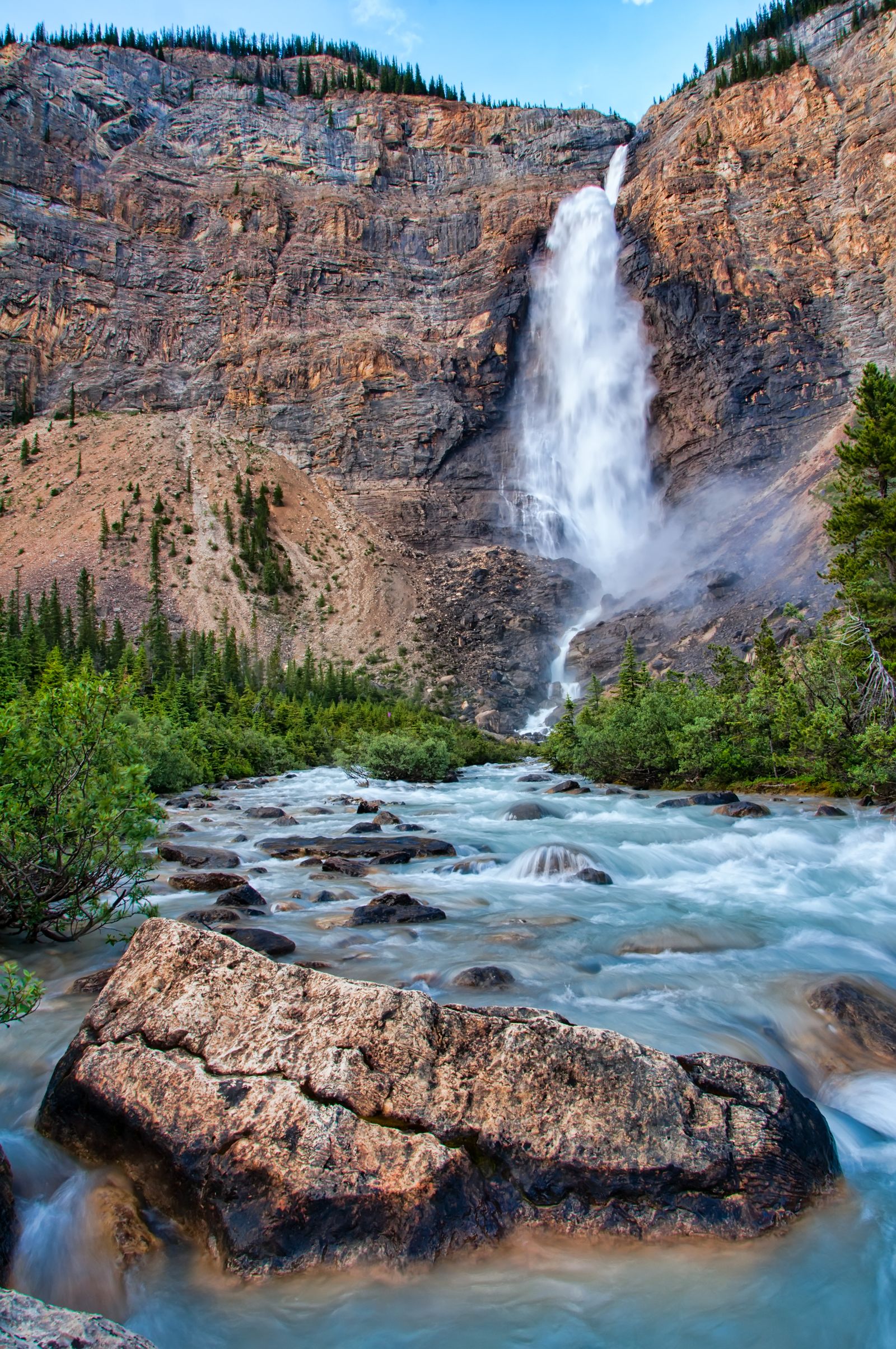Scenic waterfall cascading over cliffs, easily viewed from a lookout