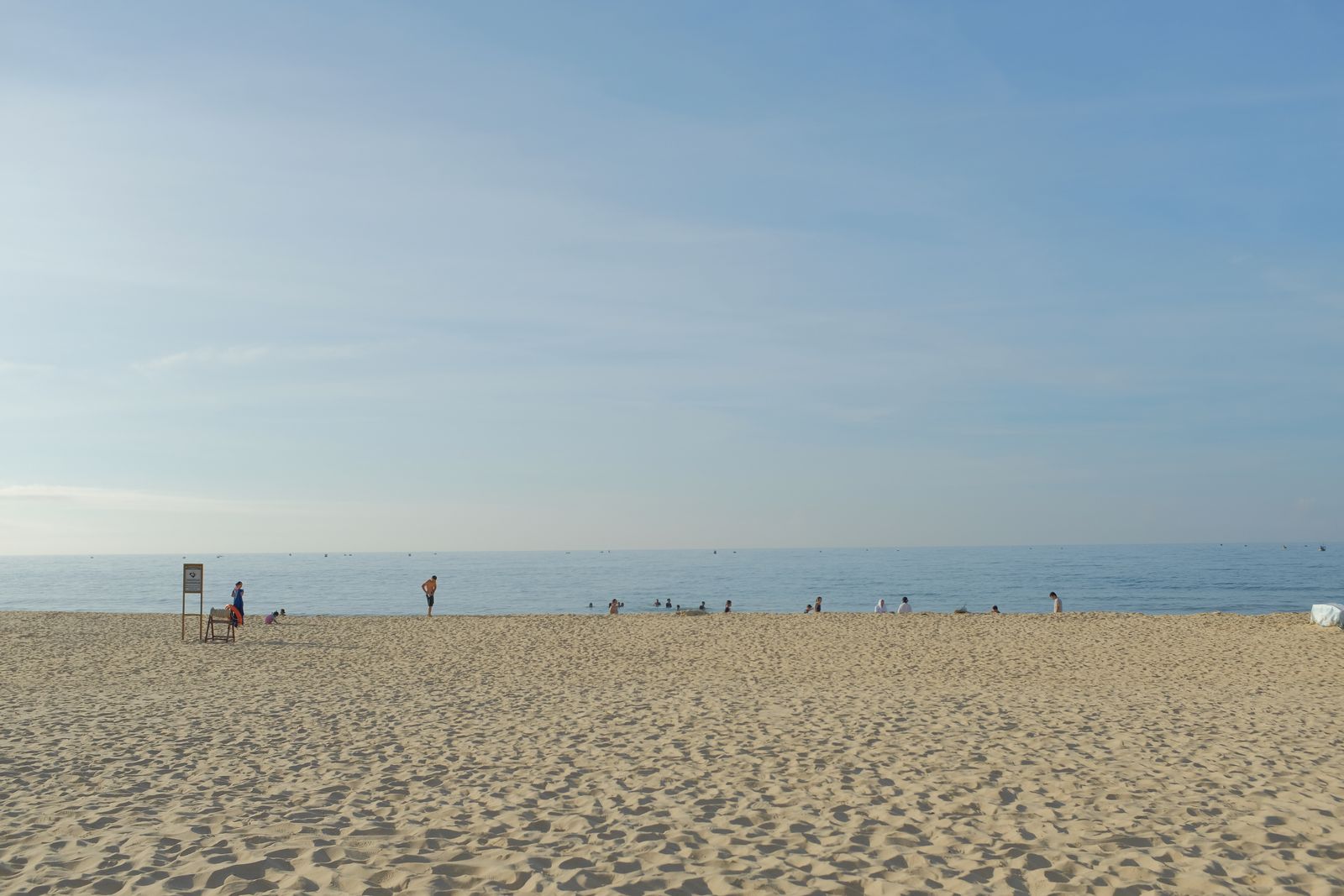 Sandy beach with calm turquoise sea