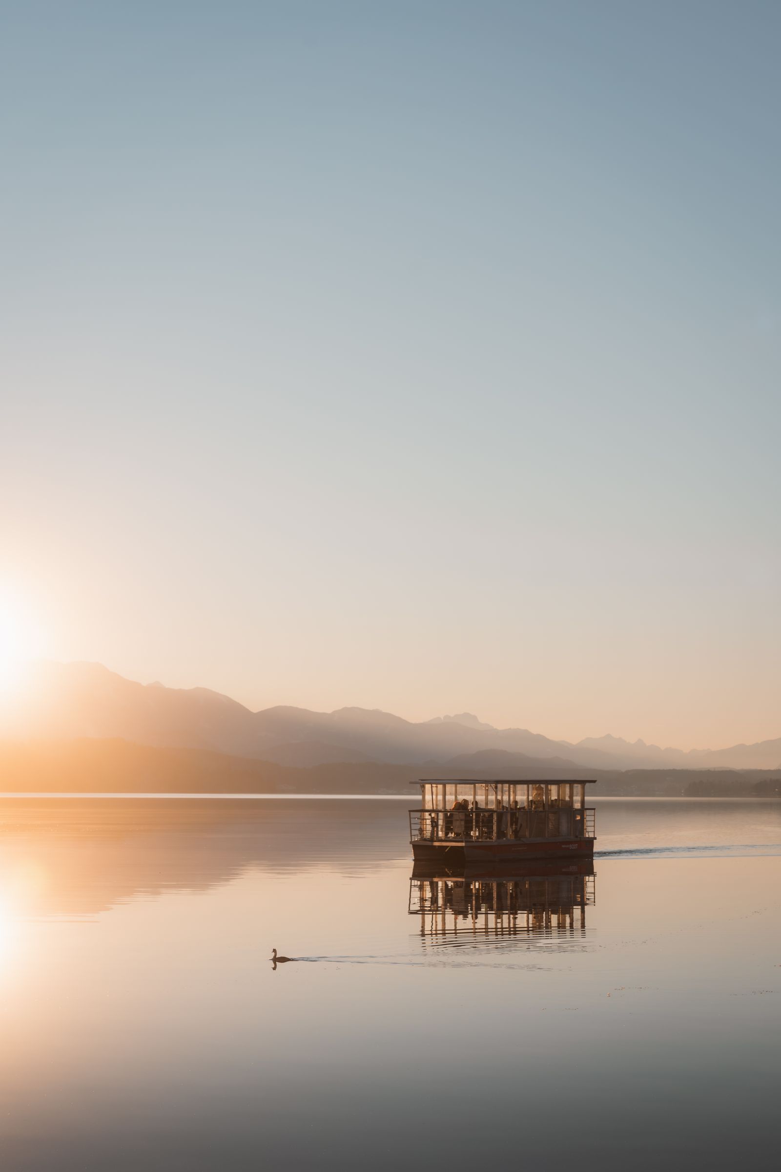 Peaceful sunrise reflecting over calm water
